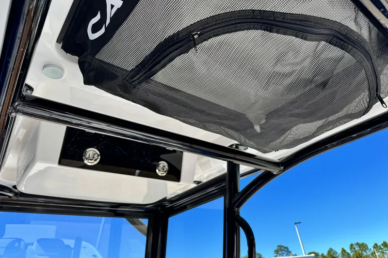 Slide: The Image of 2026 Caymas 28 HB boat interior with mesh storage and sleek design. - 25