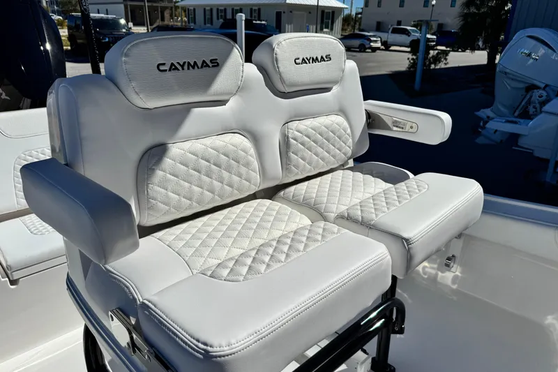 Slide: The Image of Luxurious seating on 2026 Caymas 28 HB boat with quilted upholstery and armrests. - 30