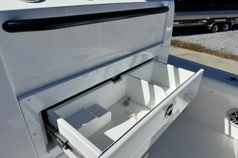 Slide: The Image of Open storage compartment on 2026 Caymas 28 HB boat, showcasing interior design. - 35
