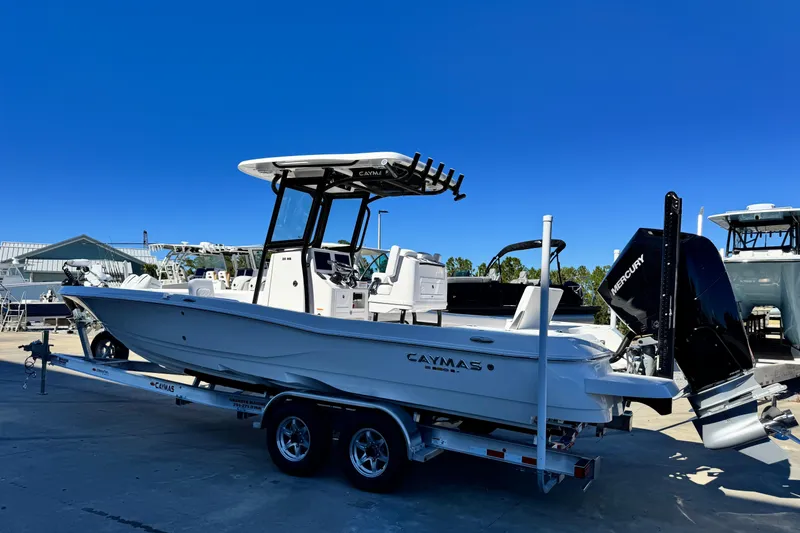 Slide: The Image of 2026 Caymas 28 HB boat on trailer, featuring sleek design and powerful Mercury engine. - 6