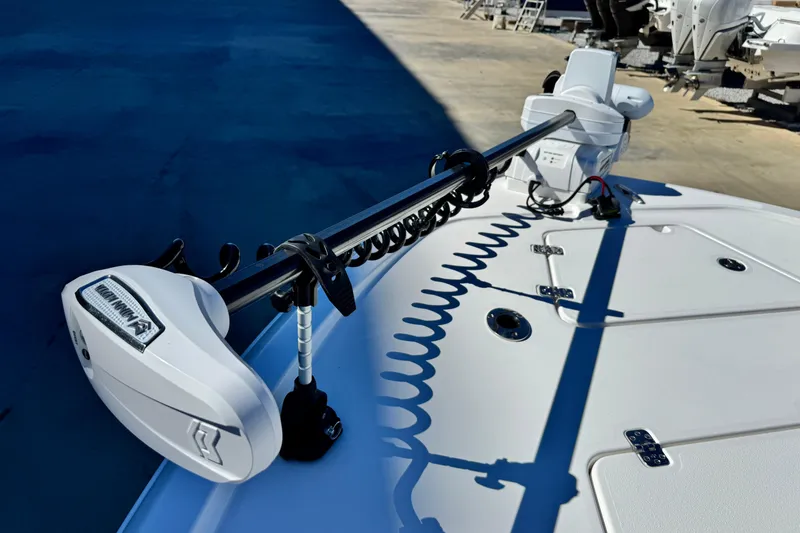 Slide: The Image of 2026 Caymas 28 HB boat deck with mounted trolling motor in sunlight. - 9
