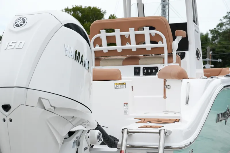 Slide: The Image of 2025 NauticStar 252 Legacy boat with Yamaha 150 engine, rear seating view. - 10