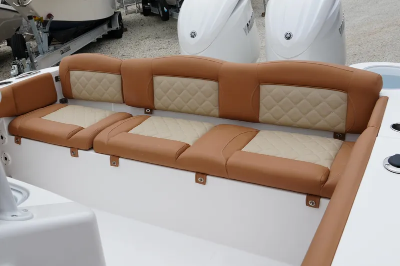 Slide: The Image of 2025 NauticStar 252 Legacy boat with tan and beige quilted seating. - 26