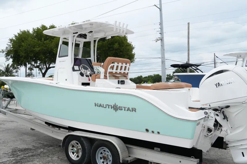 Slide: The Image of 2025 NauticStar 252 Legacy boat on trailer with Yamaha engine, mint green hull. - 8