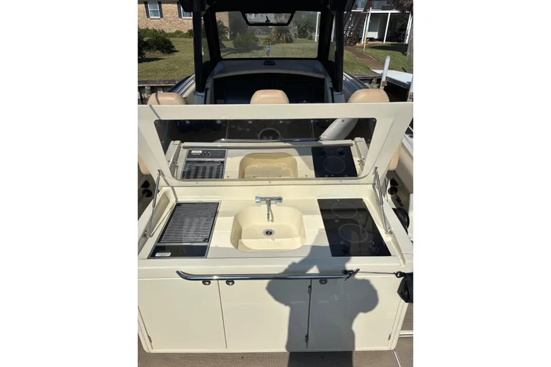 Slide: The Image of 2018 Chris-Craft 350 Catalina boat kitchen with sink and stove. - 11