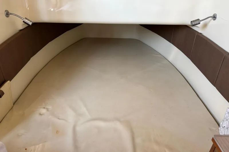 Slide: The Image of 2018 Chris-Craft 350 Catalina cabin interior with beige and brown upholstery. - 13