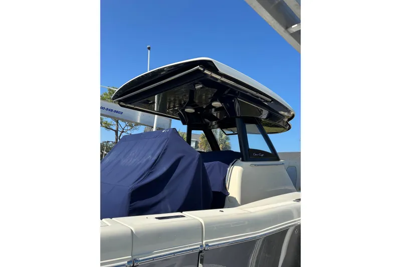 Slide: The Image of 2018 Chris-Craft 350 Catalina boat with covered seating, sleek design, and modern features. - 20