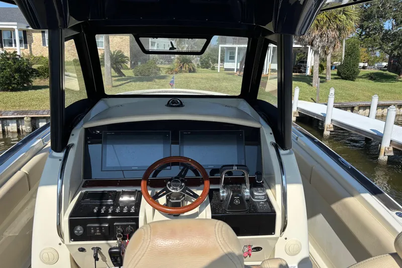Slide: The Image of 2018 Chris-Craft 350 Catalina helm with modern controls and dual screens. - 7