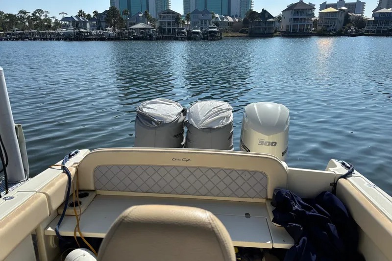 Slide: The Image of 2018 Chris-Craft 350 Catalina boat with twin engines on a calm waterfront. - 9
