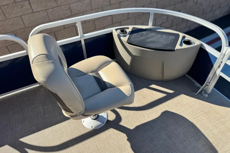 Slide: The Image of 2023 Sun Tracker Bass Buggy 18 DLX boat interior with swivel seat and console. - 11