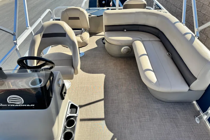 Slide: The Image of 2023 Sun Tracker Bass Buggy 18 DLX interior with seating and steering console. - 15