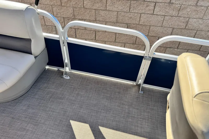 Slide: The Image of 2023 Sun Tracker Bass Buggy 18 DLX interior with seating and railing detail. - 16