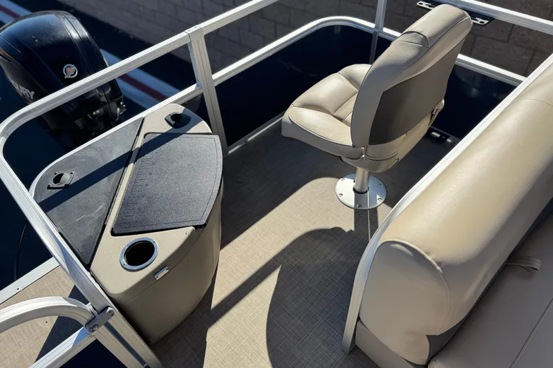 Slide: The Image of 2023 Sun Tracker Bass Buggy 18 DLX interior with seating and console. - 19