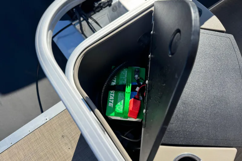 Slide: The Image of Battery compartment of 2023 Sun Tracker Bass Buggy 18 DLX pontoon boat. - 21