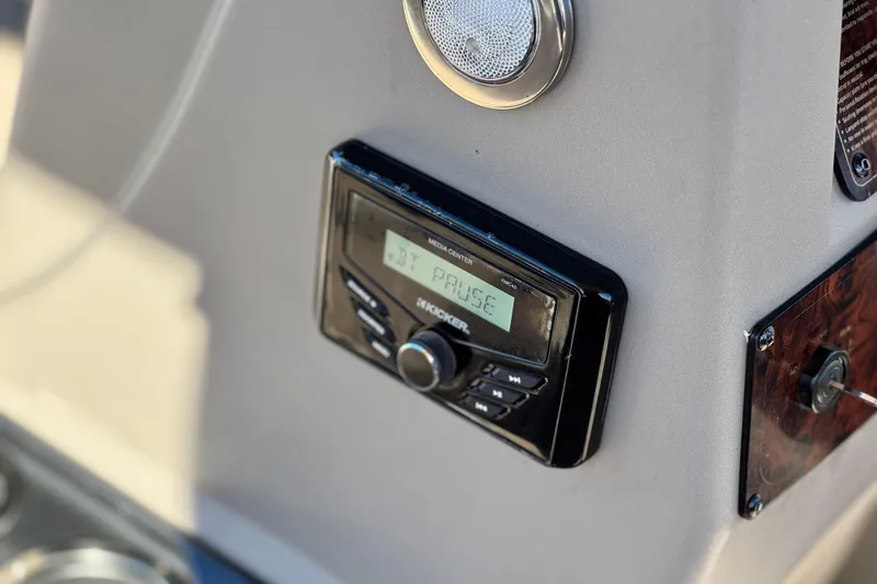 Slide: The Image of 2023 Sun Tracker Bass Buggy 18 DLX boat console with media center display. - 26