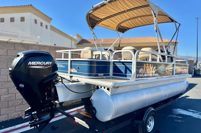 Slide: The Image of 2023 Sun Tracker Bass Buggy 18 DLX pontoon boat with Mercury outboard motor. - 6
