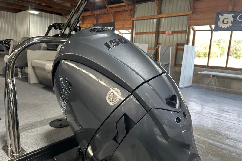 Slide: The Image of 2026 Godfrey Xperience 2286 SBX boat with Yamaha 150 engine in a showroom. - 3