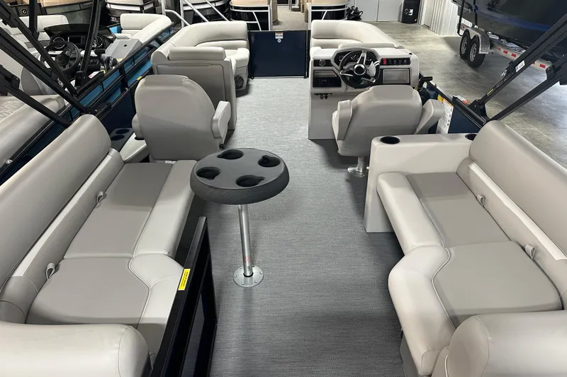 Slide: The Image of 2026 Godfrey Xperience 2286 SBX pontoon boat interior with spacious seating and modern helm. - 4
