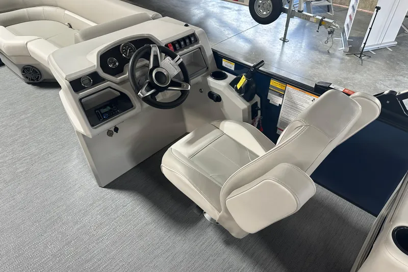 Slide: The Image of 2026 Godfrey Xperience 2286 SBX boat interior with steering console and captain's chair. - 5