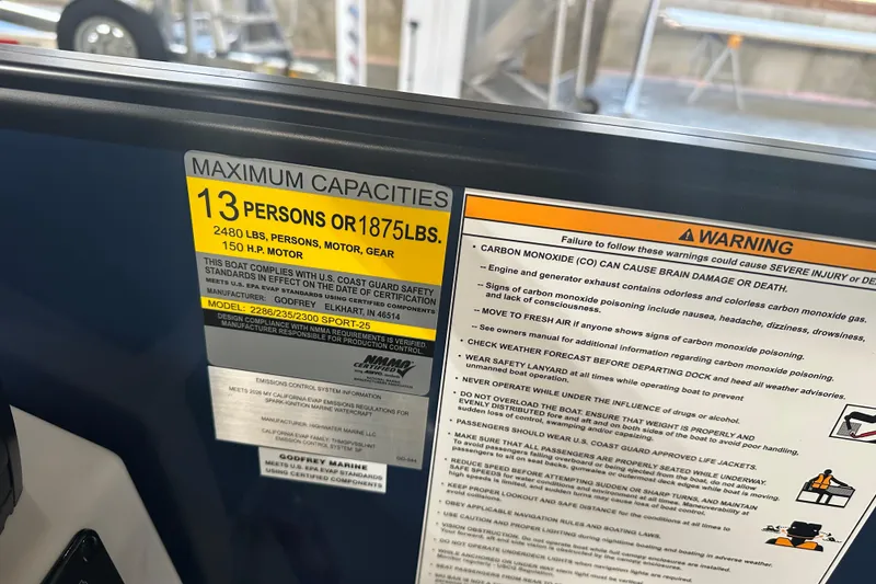 Slide: The Image of 2026 Godfrey Xperience 2286 SBX boat capacity label, 13 persons or 1875 lbs, safety warnings. - 7