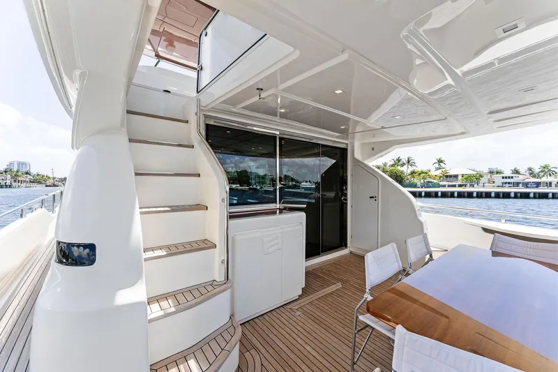 Slide: The Image of Luxurious 2015 Ferretti Yachts 690 deck with elegant seating and staircase. - 42