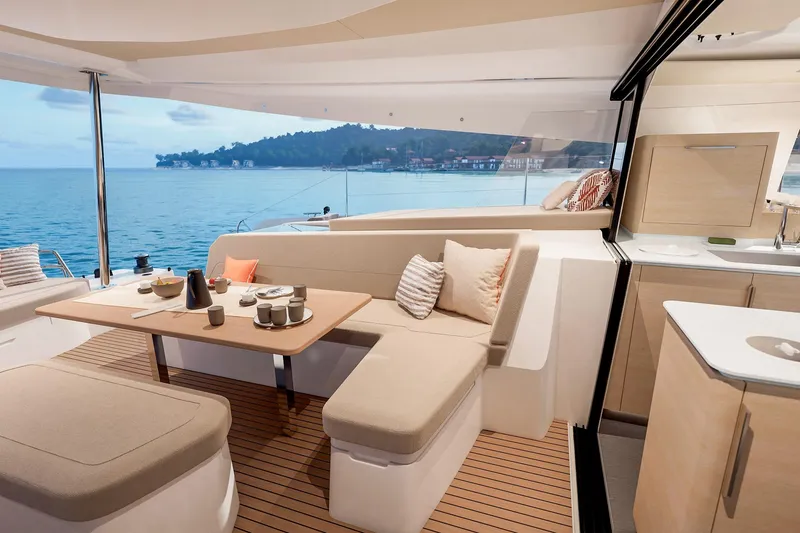 Slide: The Image of Luxurious interior of 2026 Fountaine Pajot 48 yacht with ocean view and elegant seating. - 13