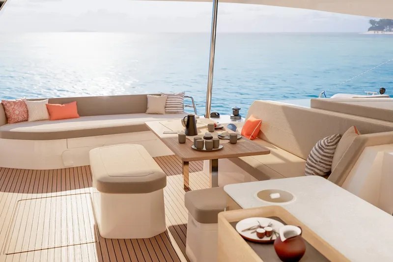 Slide: The Image of Luxurious 2026 Fountaine Pajot 48 yacht interior with elegant seating and ocean view. - 15