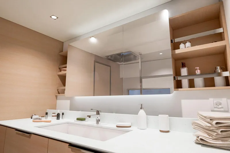 Slide: The Image of Modern bathroom interior on 2026 Fountaine Pajot 48 yacht, featuring sleek design and ample storage. - 3