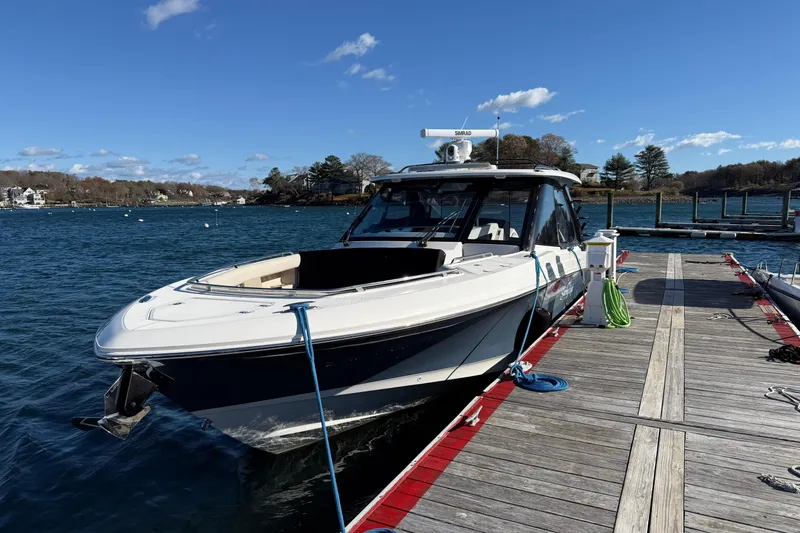 The Image of 2024 Boston Whaler 380 Realm docked on a sunny day, showcasing sleek design. - 0