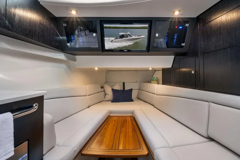 Slide: The Image of Manufacturer Provided Image: Luxurious interior of 2024 Boston Whaler 380 Realm with plush seating and modern amenities. - 11