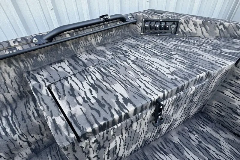 Slide: The Image of Camouflage-patterned interior of 2025 Havoc 1756 MRST boat with control panel and handle. - 12