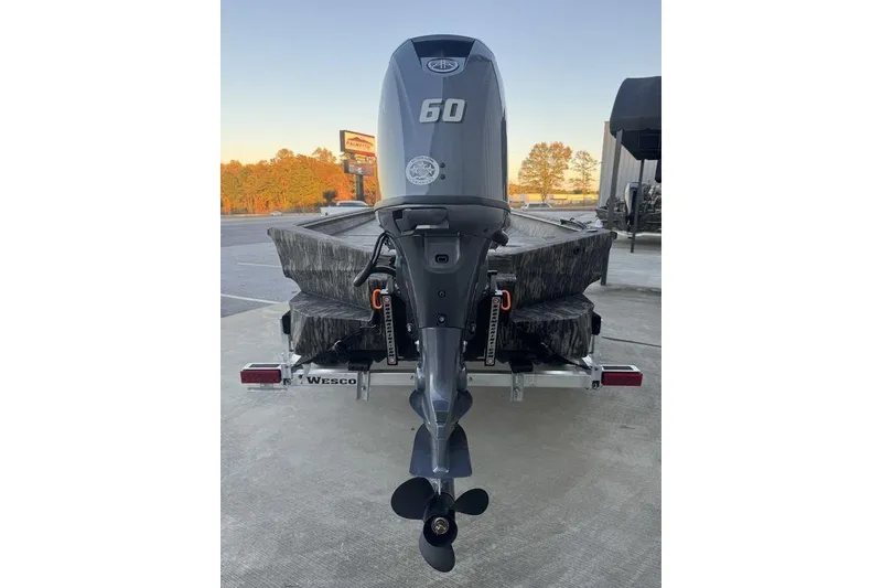 Slide: The Image of 2025 Havoc 1756 MRST boat with 60 HP outboard motor on trailer. - 5