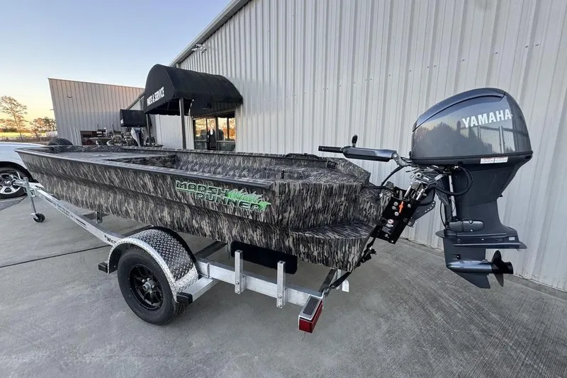 Slide: The Image of 2025 Havoc 1756 MRST boat with Yamaha motor on trailer, camo design. - 6