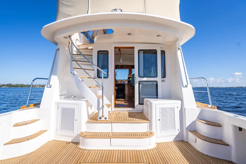 Slide: The Image of 2008 Grand Banks 47 Eastbay FB yacht deck with elegant wood finish and ocean view. - 12