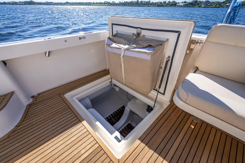 Slide: The Image of 2008 Grand Banks 47 Eastbay FB yacht with open storage compartment on teak deck. - 15