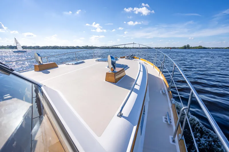 Slide: The Image of 2008 Grand Banks 47 Eastbay FB cruising on a sunny day, with clear blue skies. - 17
