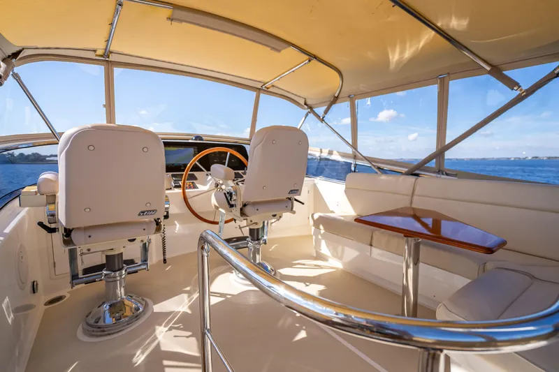 Slide: The Image of 2008 Grand Banks 47 Eastbay FB yacht interior with helm, seating, and ocean view. - 21