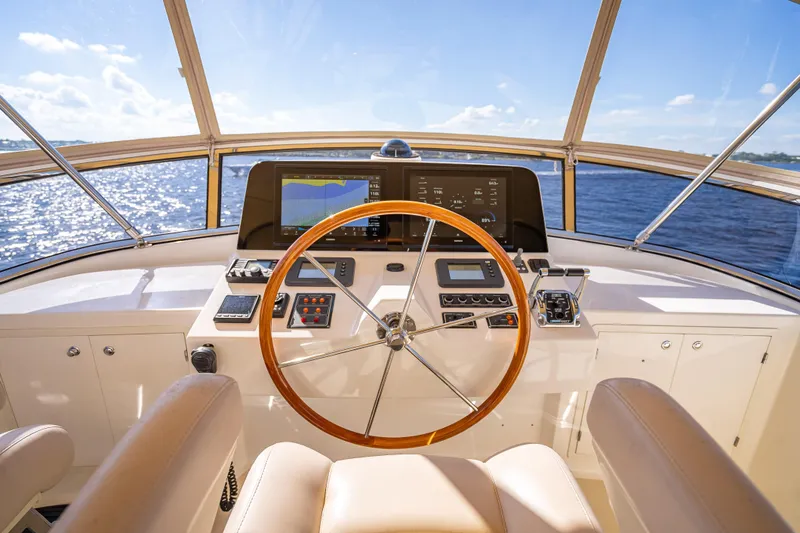 Slide: The Image of 2008 Grand Banks 47 Eastbay FB helm with wooden steering wheel and navigation equipment. - 26
