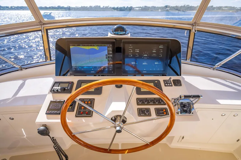 Slide: The Image of Helm of 2008 Grand Banks 47 Eastbay FB with navigation screens and wooden steering wheel. - 27