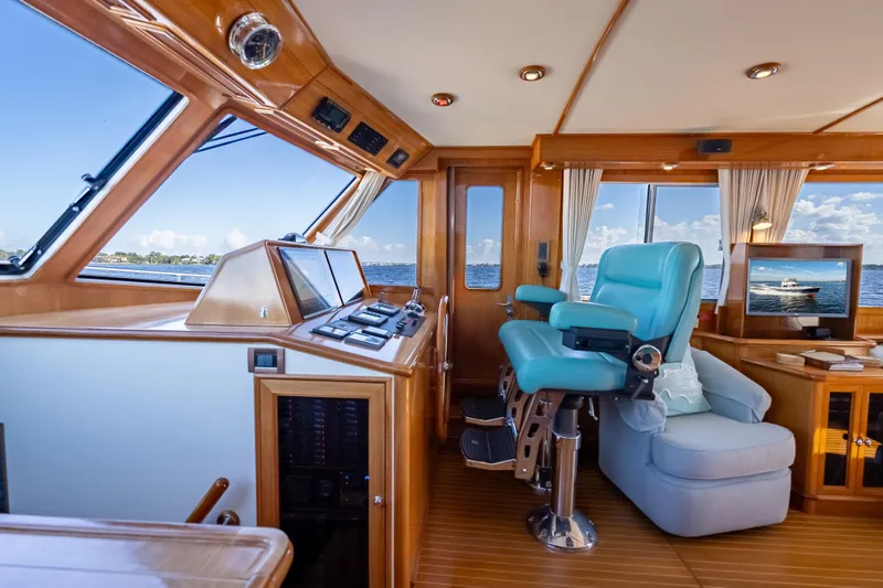 Slide: The Image of Luxurious 2008 Grand Banks 47 Eastbay FB yacht interior with captain's chair and navigation controls. - 36