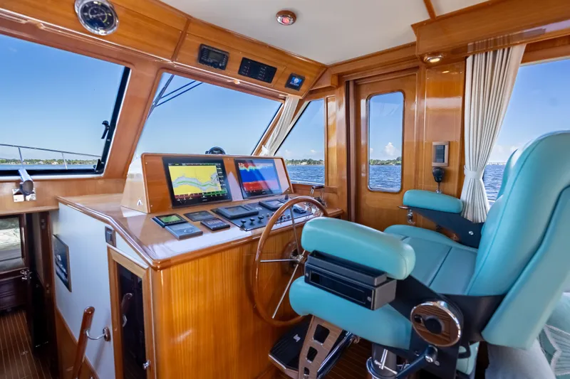 Slide: The Image of Luxurious helm of 2008 Grand Banks 47 Eastbay FB with navigation displays. - 37