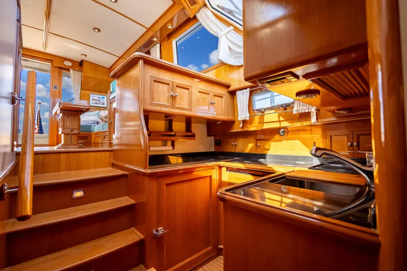 Slide: The Image of Luxurious 2008 Grand Banks 47 Eastbay FB yacht interior with polished wood finishes and modern kitchen. - 41