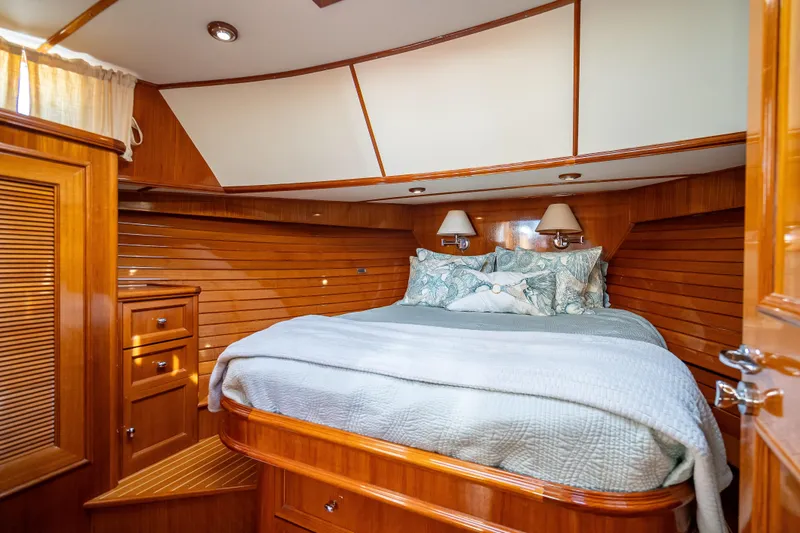 Slide: The Image of Luxurious 2008 Grand Banks 47 Eastbay FB yacht cabin with cozy bedding and elegant wood finish. - 47