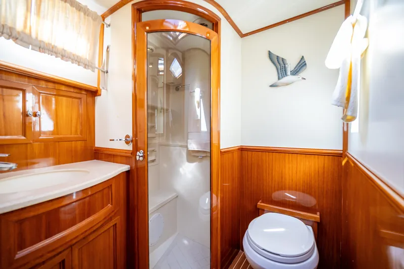 Slide: The Image of Luxurious 2008 Grand Banks 47 Eastbay FB yacht bathroom with wood accents and modern fixtures. - 49
