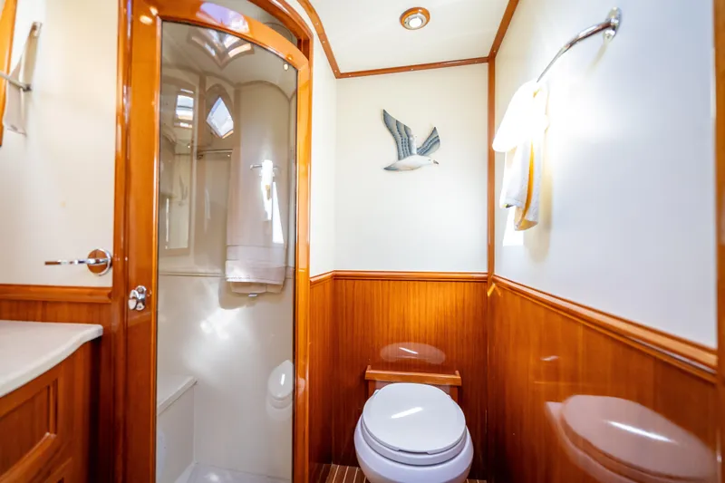 Slide: The Image of Luxurious 2008 Grand Banks 47 Eastbay FB yacht bathroom with wood accents and modern fixtures. - 50