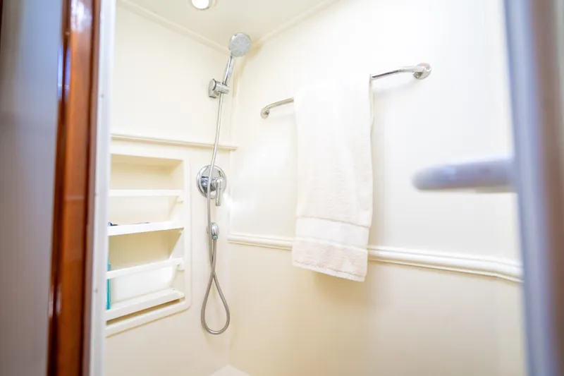 Slide: The Image of Shower area in 2008 Grand Banks 47 Eastbay FB yacht, featuring towel and shelves. - 57