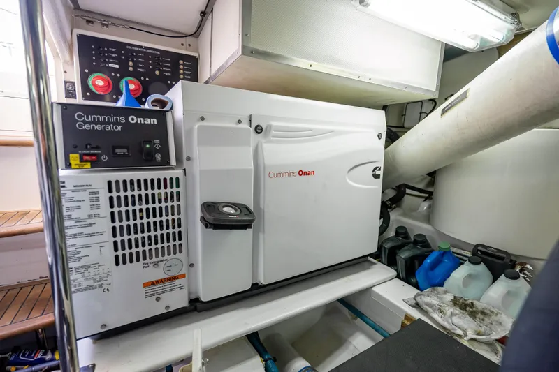 Slide: The Image of Cummins Onan generator in 2008 Grand Banks 47 Eastbay FB engine room. - 61
