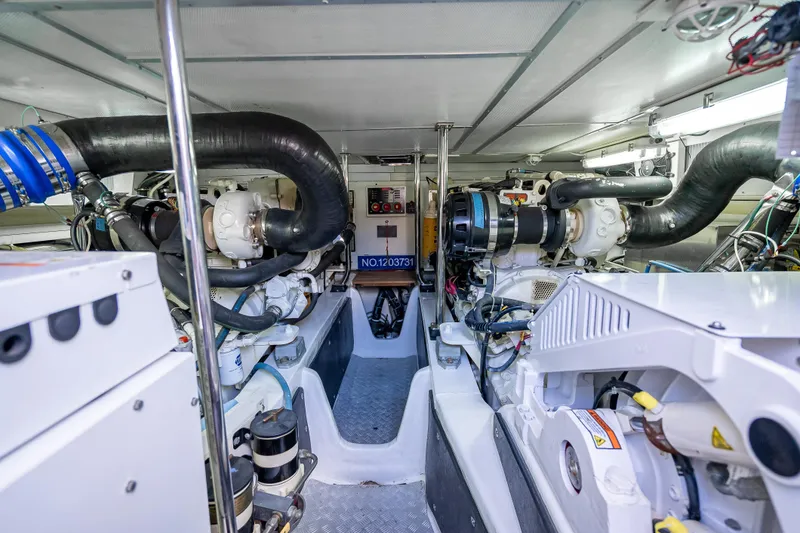 Slide: The Image of Engine room of 2008 Grand Banks 47 Eastbay FB yacht, showcasing mechanical components and systems. - 64