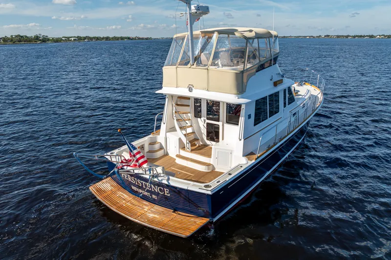 Slide: The Image of 2008 Grand Banks 47 Eastbay FB yacht cruising on open water. - 7