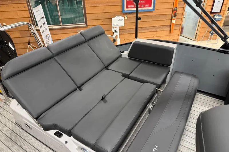 Slide: The Image of 2026 Harris Grand Mariner 250 boat interior with sleek gray seating and modern design. - 15